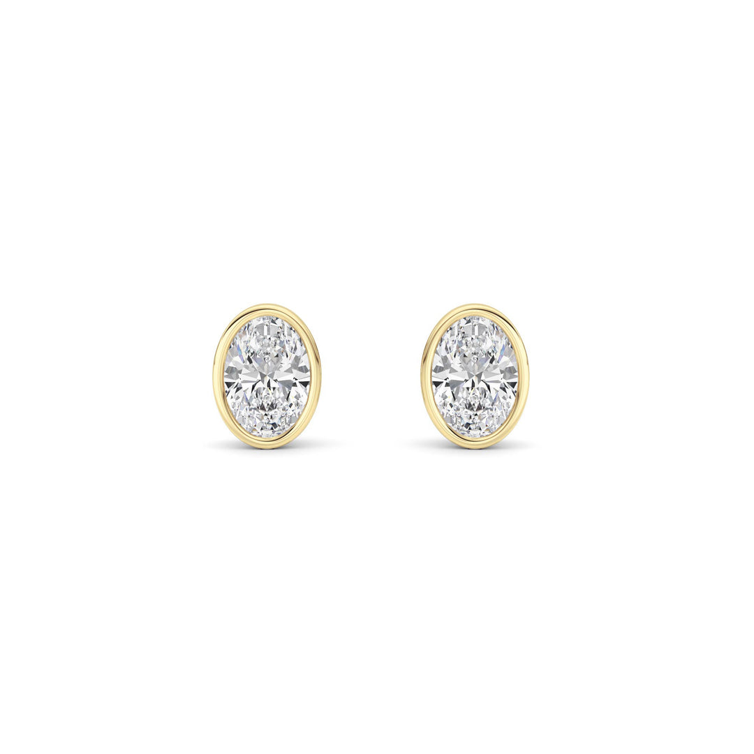 1CTW Oval Shaped Lab Grown Diamond (F/VS) Bezel Set Stud Earrings in 14K Gold
